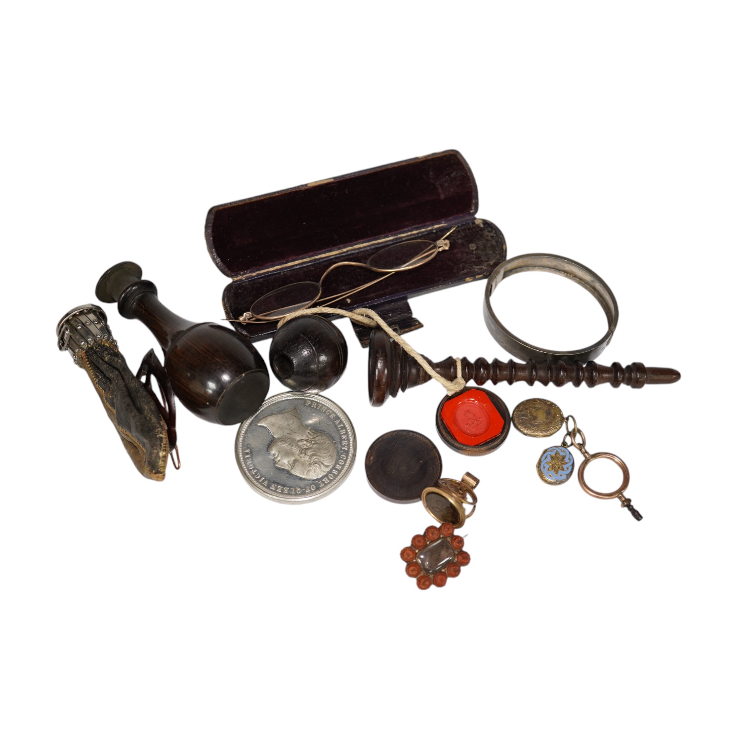A group of various oddities to include a miser's purse, a lignum vitae ball and cup game, a mourning brooch, spectacles etc. Condition - varies